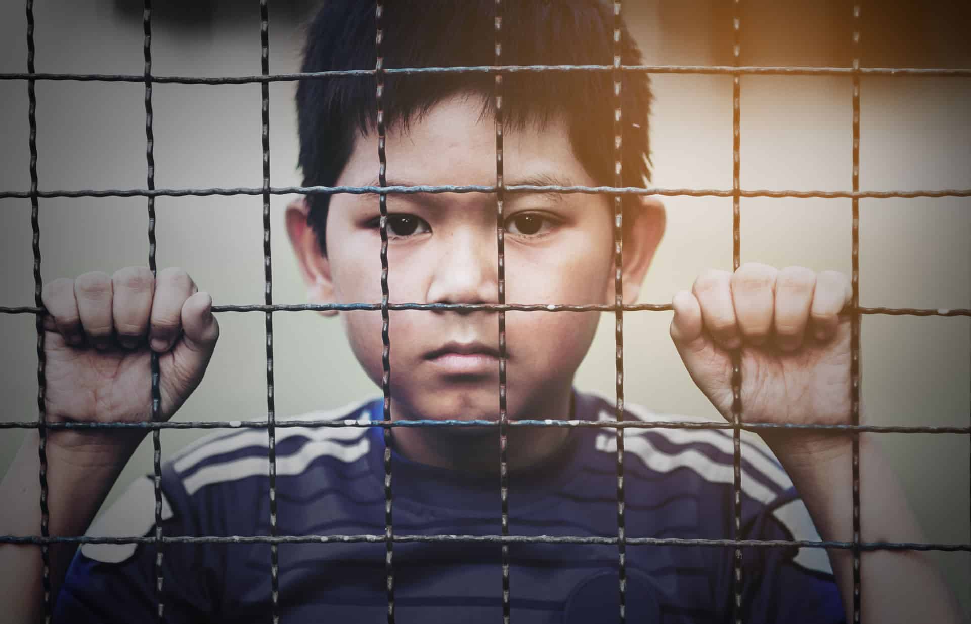 Separated Child behind Fence