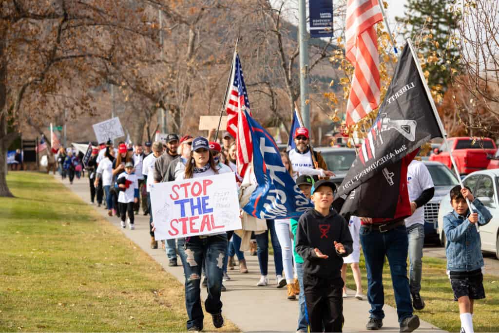 Protestors with a Stop the Steal sign