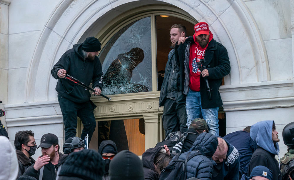 Protestors breaking Capitol Building windows