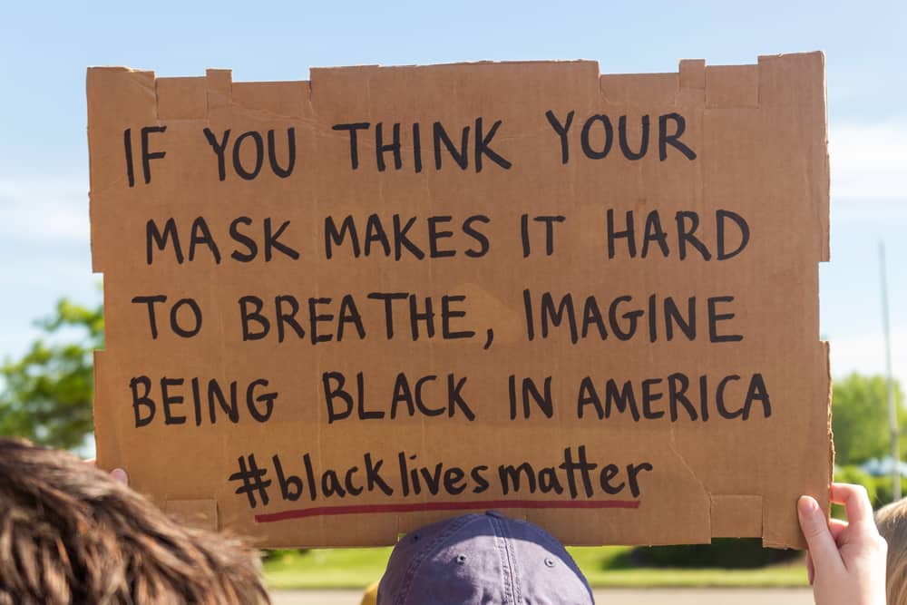 Sign saying "If you think your mask makes it hard to breathe, imagine being black in America"