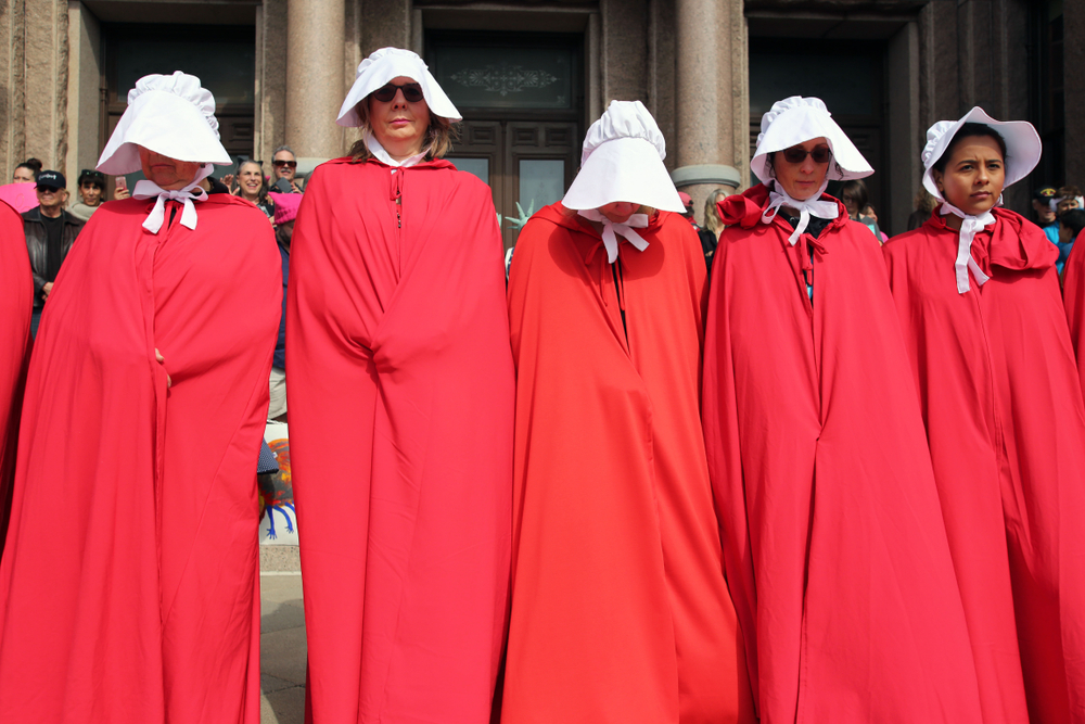 Women depicting Handmaid's Tale outfits