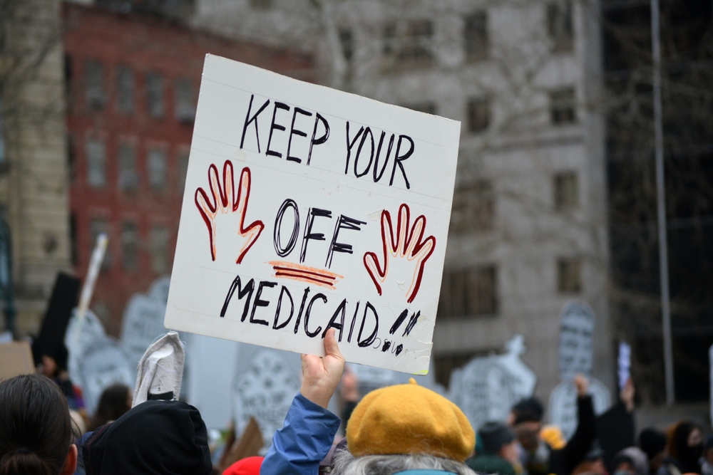 Sign saying "Keep your hands off medicaid!"