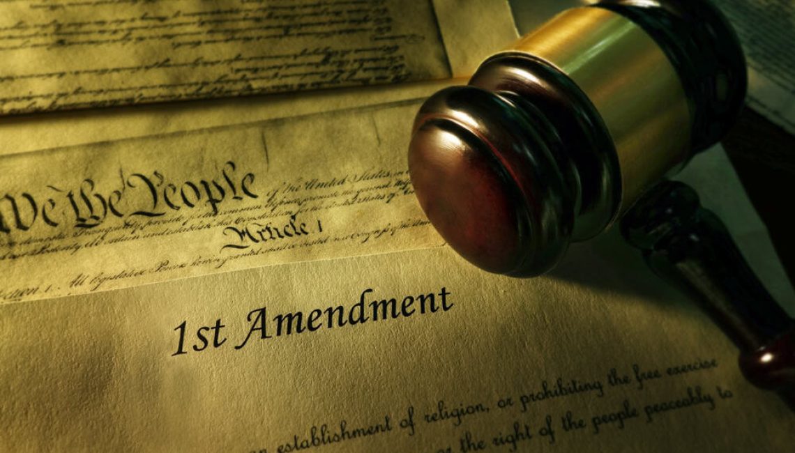 The Constitution with the words "1st Amendment"