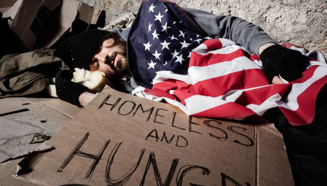 Homeless Man Sleeping with American Flag